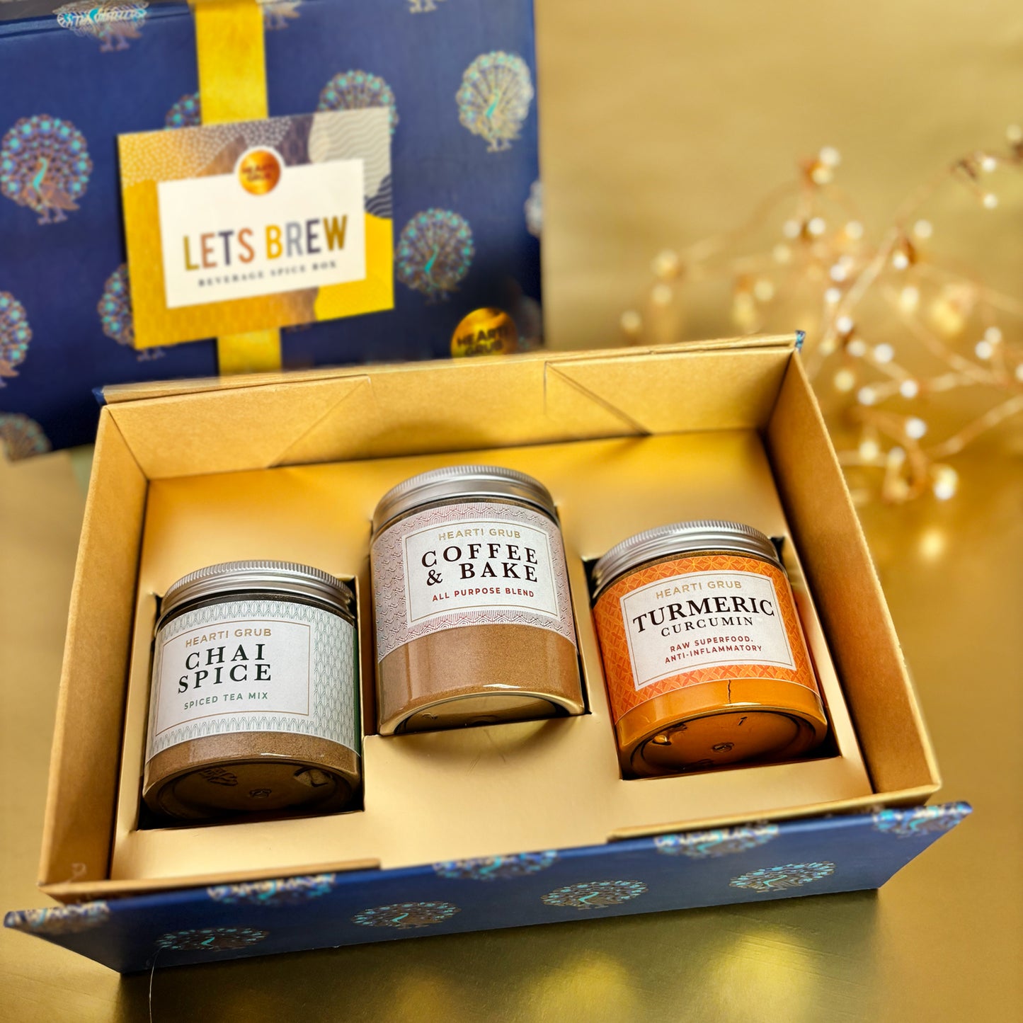 Artisan Let’s Brew Spice Box containing chai spice, pure turmeric, and coffee & bake blends, styled as a premium gift for brewing teas, coffees, and homemade bakes. Handmade in small batches by HeartiGrub. Made in Dubai, UAE. Delivery throughout UAE. Ramadan and Eid Gift. Corporate Gifting. Wellness Gifts.