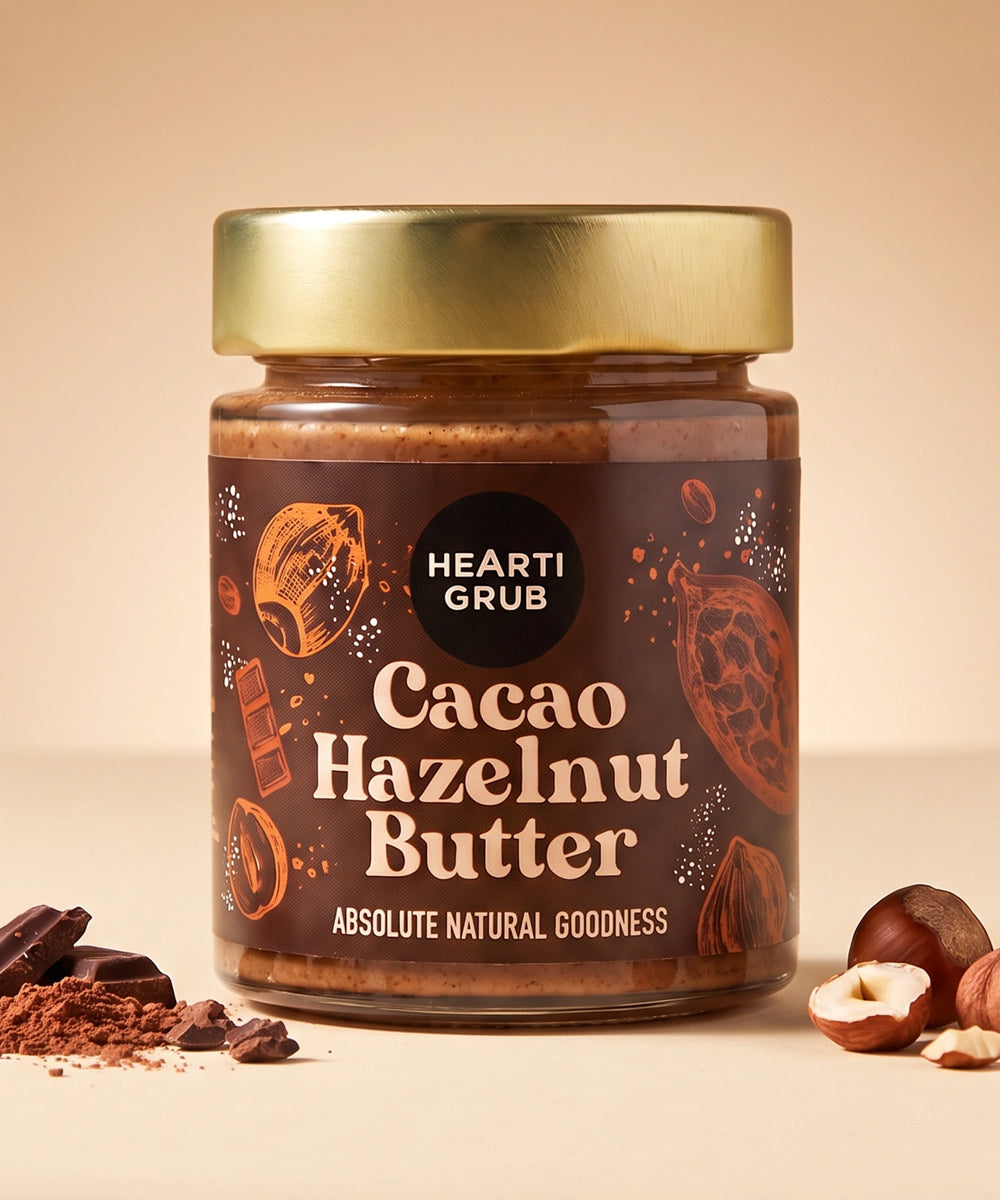 CACAO HAZELNUT BUTTER by HEARTIGRUB. RAW CACAO, TURKISH HAZELNUTS, HINT OF HONEY. THE BETTER HAZELNUT SPREAD by HEARTIGRUB. Our Best Seller. The Better Cacao Hazelnut Spread. No Nasties. No Palm Oil. Made proudly in Dubai, UAE. Small BAtch Made. Artisanal Nut Butters. Delivery throughout the UAE
