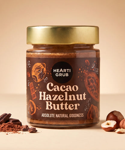 CACAO HAZELNUT BUTTER by HEARTIGRUB. RAW CACAO, TURKISH HAZELNUTS, HINT OF HONEY. THE BETTER HAZELNUT SPREAD by HEARTIGRUB. Our Best Seller. The Better Cacao Hazelnut Spread. No Nasties. No Palm Oil. Made proudly in Dubai, UAE. Small BAtch Made. Artisanal Nut Butters. Delivery throughout the UAE