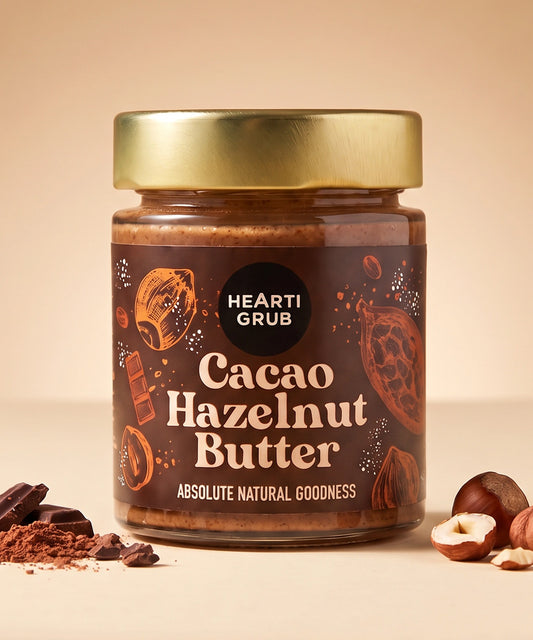 CACAO HAZELNUT BUTTER by HEARTIGRUB. RAW CACAO, TURKISH HAZELNUTS, HINT OF HONEY. THE BETTER HAZELNUT SPREAD by HEARTIGRUB. Our Best Seller. The Better Cacao Hazelnut Spread. No Nasties. No Palm Oil. Made proudly in Dubai, UAE. Small BAtch Made. Artisanal Nut Butters. Delivery throughout the UAE