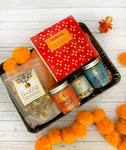Gift set with Modak, Ganesh Chaturthi items. Gift Basket. Ganesh Chaturthi. Gifting. Made in Small Batches. Deliciously Decadent. Vegan Gluten Free Refined Sugar Free. Delicious Modak. Nuts. Delivery throughout U.A.E. HeartiGrub