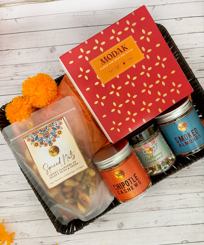 Gift set with Modak, Ganesh Chaturthi items. Gift Basket. Ganesh Chaturthi. Gifting. Made in Small Batches. Deliciously Decadent. Vegan Gluten Free Refined Sugar Free. Delicious Modak. Nuts. Delivery throughout U.A.E. HeartiGrub