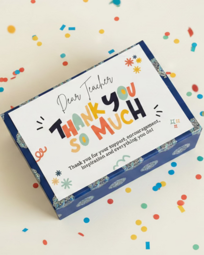 Teachers Day Gift hamper. Made by HeartiGrub. Made in UAE. Colorful card with 'Thank you so much' message on a textured surface