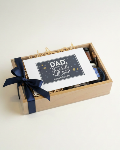 Gift box with a card and blue ribbon on a white background. HeartiGrub. Delivery through UAE. Fathers Day gifts.