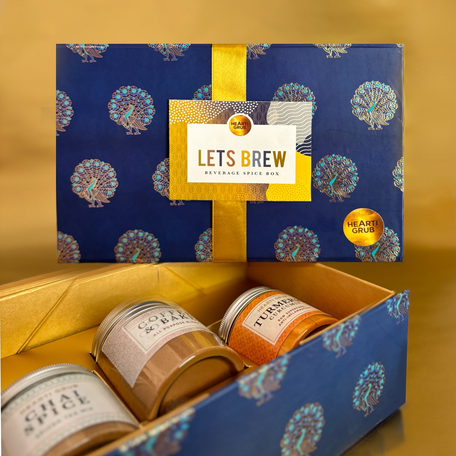 Artisan Let’s Brew Spice Box containing chai spice, pure turmeric, and coffee & bake blends, styled as a premium gift for brewing teas, coffees, and homemade bakes. Handmade in small batches by HeartiGrub. Made in Dubai, UAE. Delivery throughout UAE. Ramadan and Eid Gift. Corporate Gifting. Wellness Gifts.