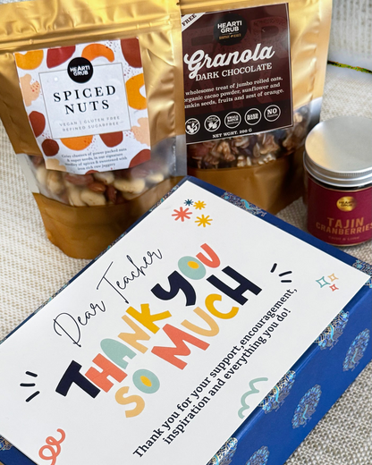 Teacher appreciation Gift Hamper with spiced nuts and granola in the background. HeartiGrub. Made in UAE. Delivery throughout the UAE. Clean Ingredients. 