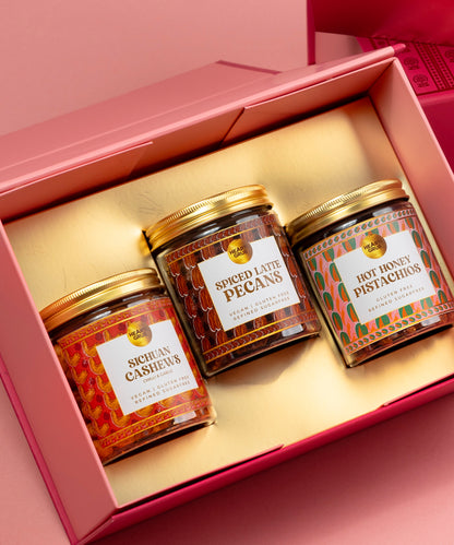Three jars of honey with labels in a pink gift box. Bespoke Diwali gift. Thoughtful gifts. No Nasties. Clean Ingredients. UAE. Dubai. Abu Dhabi. Sharjah. Delivery throughout UAE. Nuts. Nut Butters