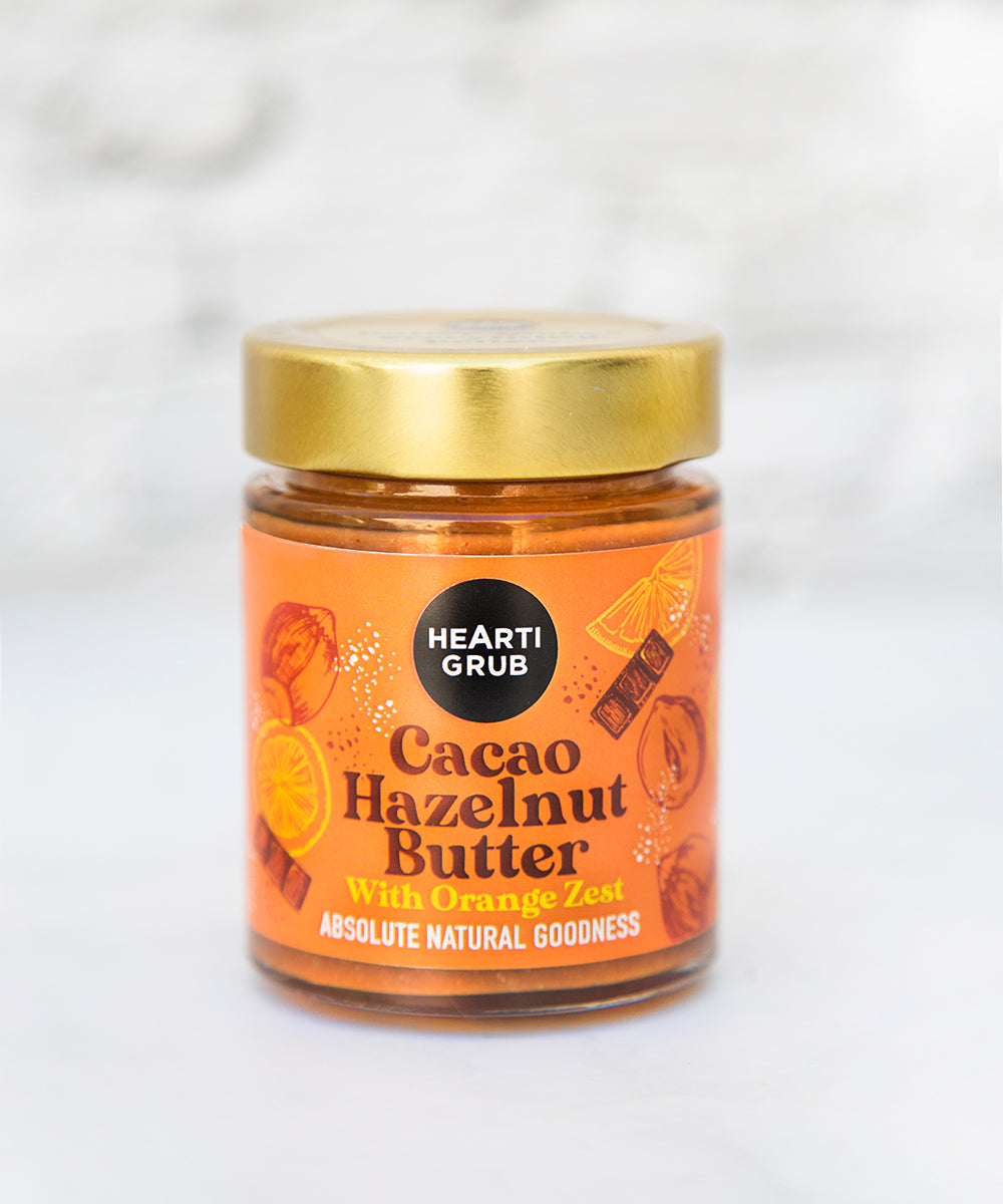 CACAO HAZELNUT BUTTER by HEARTIGRUB. RAW CACAO, TURKISH HAZELNUTS, HINT OF HONEY. THE BETTER HAZELNUT BUTTER WITH ORANGE ZEST By HEARTIGRUB. Made in Dubai, UAE. Nut Butter s and Spreads. Gift Delivery in UAE. Artisanal Spreads. No Nasties. Homegrown Biz. Women Led. Clean Nut Butters. 